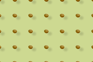 Colorful pattern of coconuts on yellow background with shadows. Top view. Flat lay. Pop art design
