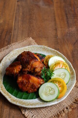 a plate of chicken roasted with vegetables 