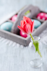 Simple Easter Decoration. Bright wooden background. Close up. Copy space.