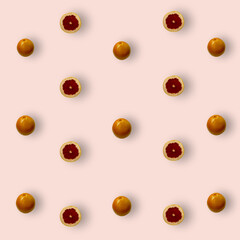 Colorful fruit pattern of fresh grapefruits on pink background. Top view. Flat lay. Pop art design