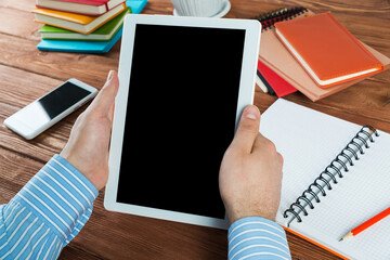 businessman with a tablet, works in the office