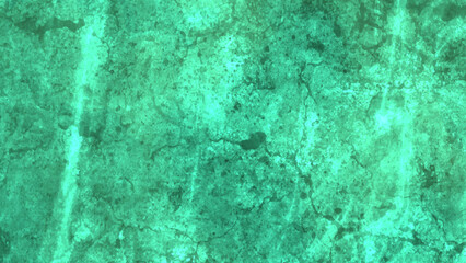 Old concrete wall sloppy painted green grungy backdrop. Trendy mint colored low contrast Concrete textured background with roughness and irregularities to your design.