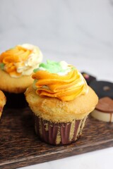 Tiranga Cupcake or Tricolor Cupcake with Indian National Flag colors frosting. saffron or orange, white and green. The concept for Indian happy Independence or Republic day greeting card. copy space.