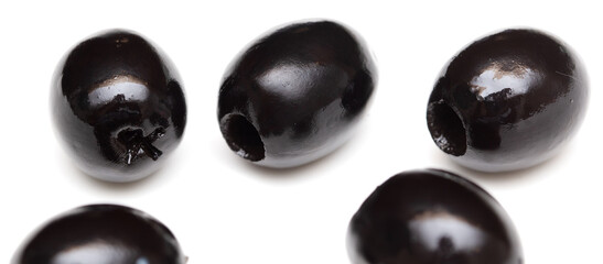 Black olives isolated on a white background.