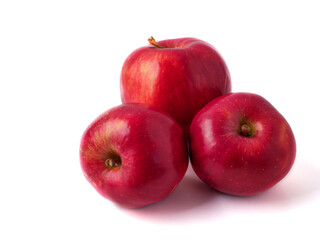 Three red apples on white background.