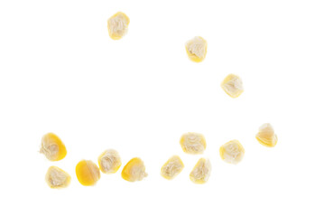 Dry grains of corn on a white background.
