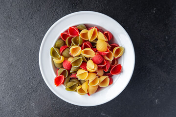 pasta conchiglie multicolored colorful mix healthy meal food snack on the table copy space food background