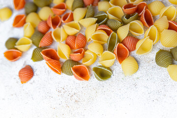 pasta conchiglie multicolored colorful mix healthy meal food snack on the table copy space food...