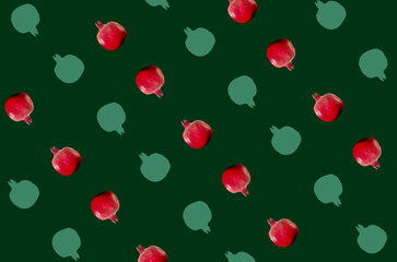 Colorful fruit pattern of fresh pomegranates on green background. Top view. Flat lay. Pop art design