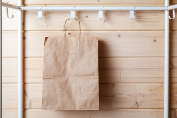 Fototapeta na wymiar An empty paper bag hangs in an empty room