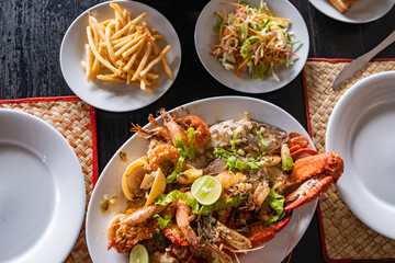 seafood platter on table with chips and salad