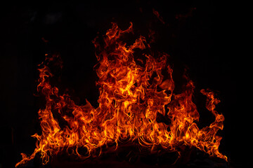 Fototapeta na wymiar Fire blaze flames on black background. Fire burn flame isolated, abstract texture. Flaming explosion effect with burning fire.