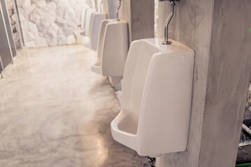 white urinals in men's toilet