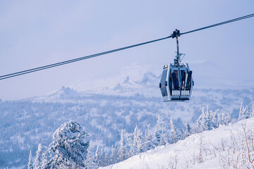 Landscape on mountain Sheregesh ski lift resort in winter sunset, aerial top view Kemerovo region Russia