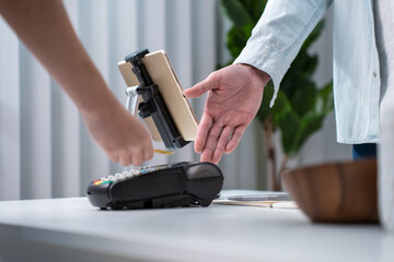 Close up hands of young man use credit card pay for vase goods order. 