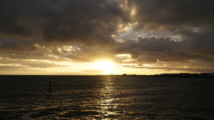 Sunset over the cloudy ocean in Perth, Australia.