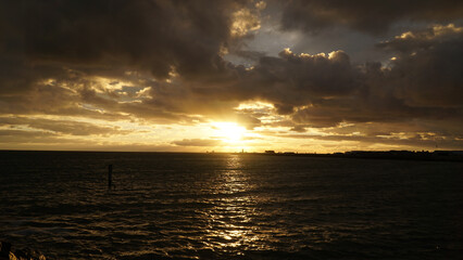Sunset over the cloudy ocean in Perth, Australia.