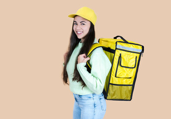 hispanic delivery woman with backpack, beige background
