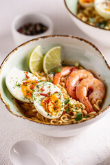 Bowl of ramen soup with shrimps and eggs