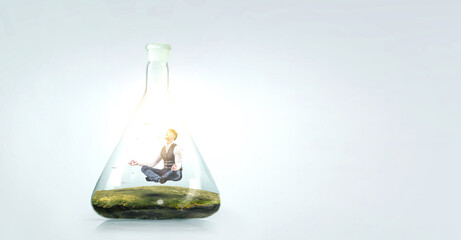 Business man doing yoga in lotus pose inside glass bottle . Mixed media