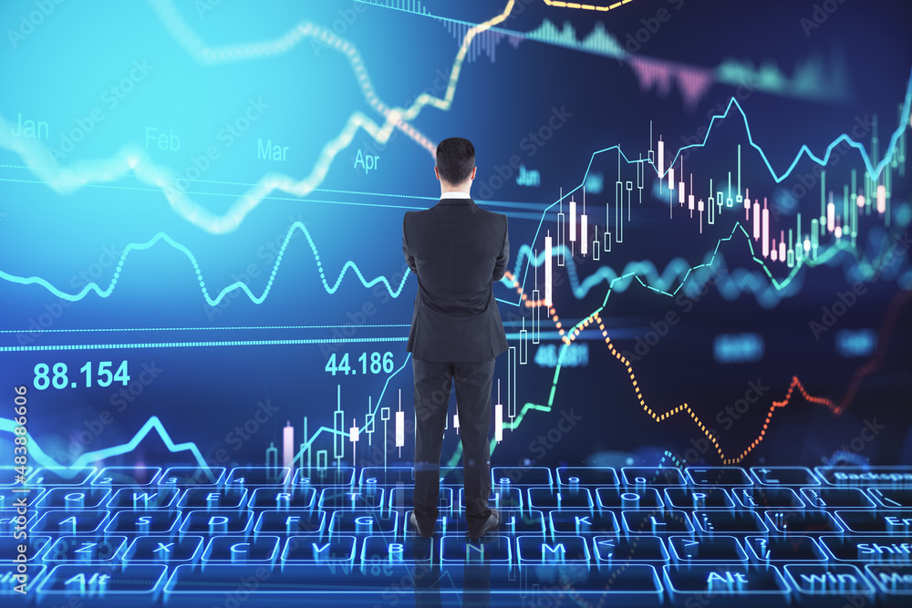 Aufkleber Back view of thoughtful young man in suit looking at abstract image of glowing digital keyboard with map and forex chart on dark background. Innovation, technology, ai, trade, and market concept.