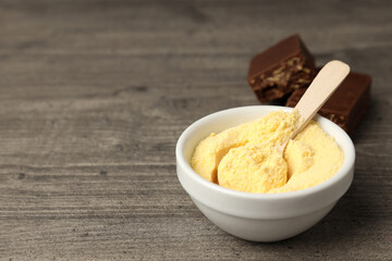 Concept of sports nutrition on gray wooden background