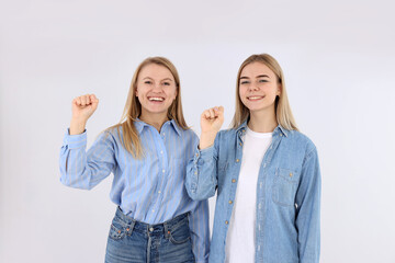 Obraz premium Girl power concept with two young women on white background
