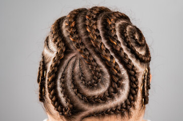 Close-up of braids on the head of a caucasian woman.