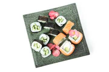 Plate with sushi rolls isolated on white background