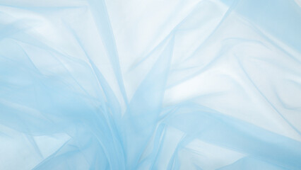 Beautiful delicate blue background mesh fluffy fabric. Banner. elegant pastel light blue tulle....
