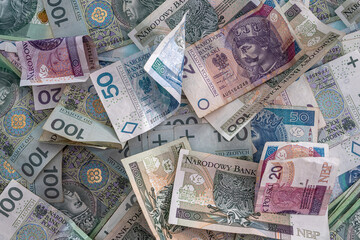 Fototapeta na wymiar pile of polish banknotes zloty as financial background