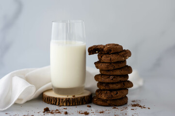 stack of double chocolate chip cookie with glass of milk