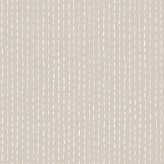 Abstract seamless pattern: white hand drawn strokes-stitches on a beige background. Fabric texture in vintage style. Scrapbook and patchwork minimalistic print. Cozy wallpaper design.