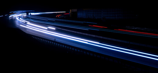 Night road lights. Lights of moving cars at night. long exposure red, blue, green, orange.