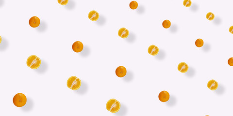 Colorful fruit pattern of fresh orange on white background with shadows. Top view. Flat lay. Pop art design