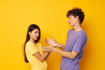 teenagers casual clothes posing emotions antics yellow background unaltered