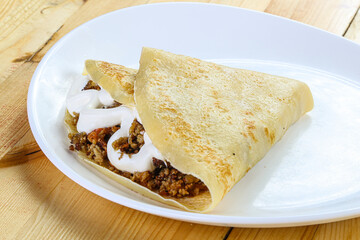 Pancake with minced meat and sauce