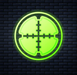 Glowing neon Sniper optical sight icon isolated on brick wall background. Sniper scope crosshairs. Vector