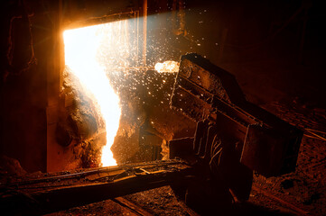 Fototapeta na wymiar Automatic sampler. The process of taking a sample of liquid metal in a steelmaking furnace