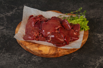 Raw chicken liver over board