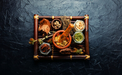 Tray with healing herbs, flat lay