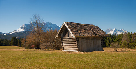 wooden barn at Buckelwiesen landscape, upper bavaria, early springtime