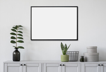 	
Blank picture frame mockup on white wall. Template for painting or poster. White living room...
