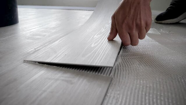 Master Glue Vinyl Tile On Adhesive Based On Floor Of Apartment Renovation