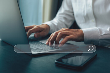 Businessman hands working with laptop computer, Searching browsing internet data information with blank search bar.