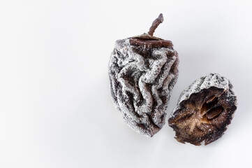 Dried persimmon on a white background. Healthy diet