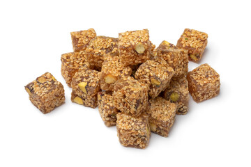 Heap of Turkish delight., lokum, with sesame seed and pistachio nuts close up isolated on white background 