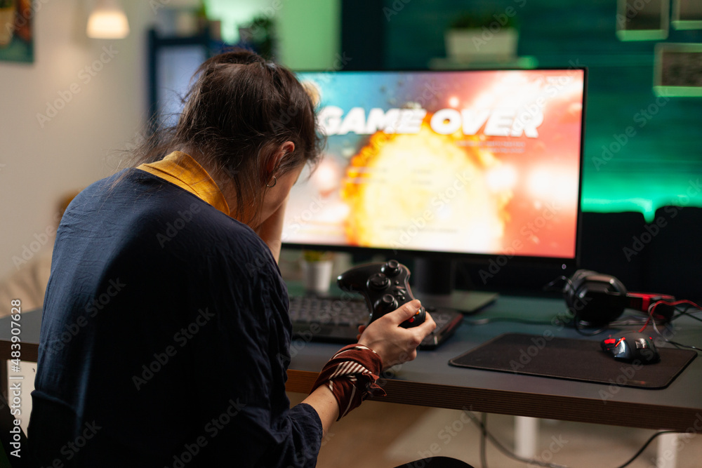 Poster angry woman playing online video games with joystick. gamer using controller on computer to play int