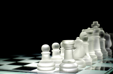 Glass chess on glass chessboard