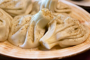 khinkali - georgian traditional food dumplings soft focus